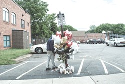 One of the memorials to the victims of the drive-by shooting on Genesee Street last week. - PHOTO BY MARK CHAMBERLIN