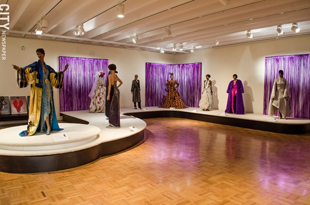 Above; Stunning ensembles — the creations of iconic couture designers as well as up-and-coming black designers — from 50 years of the Ebony Fashion Fair are installed in the MAG's Grand Gallery. - PHOTO BY MARK CHAMBERLIN