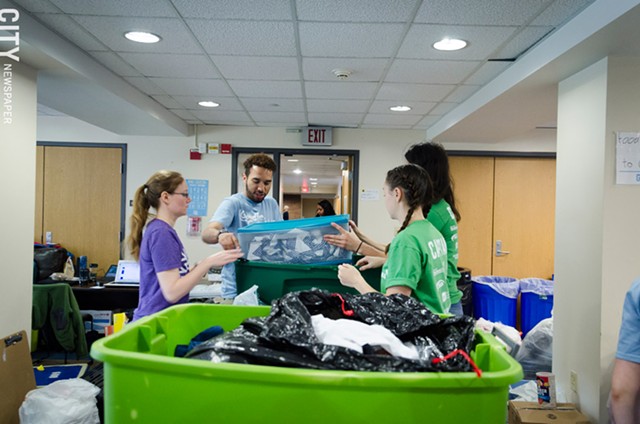 RIT volunteers sort through items collected through the Goodbye, Goodbuy! effort. - PHOTO BY MARK CHAMBERLIN