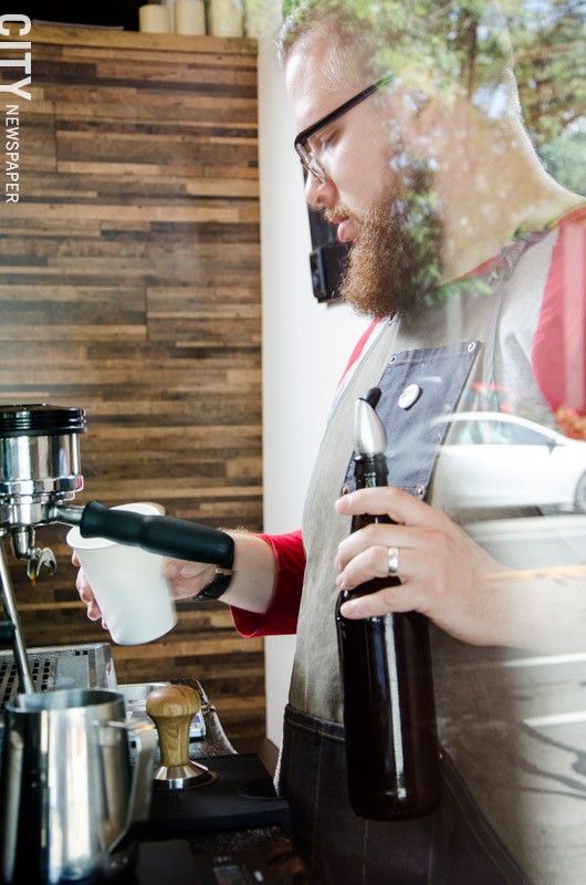 Meraki Coffee Co. owner Ryan Baker works the espresso bar at Cheesy Eddie's, where his pop-up company offers such signature concoctions as the Salted Nutella Latte and a carbonated iced espresso beverage made with Fizz Cola. - PHOTO BY MARK CHAMBERLIN