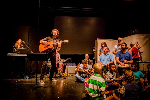 Topher Holt and is bandmates playing for kids at the School of the Arts on Sunday. - PHOTO BY JOSH SAUNDERS