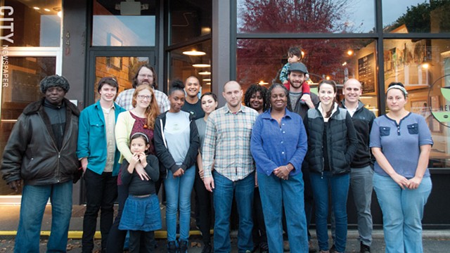 Volunteers with City Roots Community Land Trust outside of New City Cafe. The group has volunteer opportunities for grant writers. - PHOTO BY RENEE HEININGER