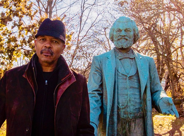 "Re-Energizing the Legacy of Frederick Douglass" project director Carvin Eison with the statue of Frederick Douglass in Highland Park. The statue will be moved to South and Robinson this spring, and is at the center of several upcoming art-related events. - PHOTO COURTESY CARVIN EISON