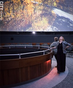 RSMC president and CEO Hillary Olson gazes up at Star Theater's dome. - PHOTO BY JACOB WALSH