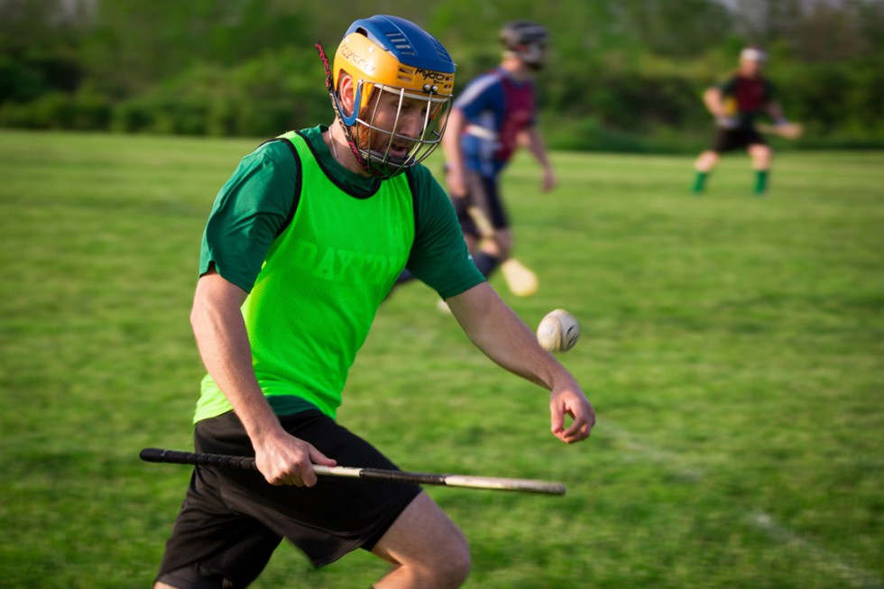 Hurling's equipment: a stick resembling an inefficient canoe paddle and a leather-wrapped cork ball. - PHOTO BY DAVE DEVER AT REVELPIX.COM