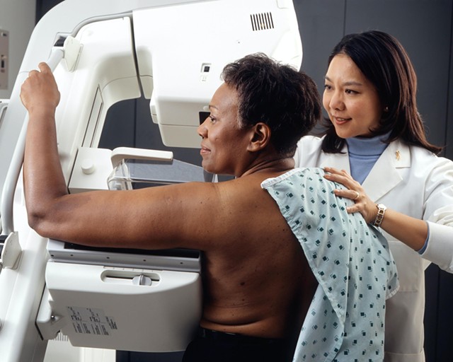 A woman undergoing a mammogram.