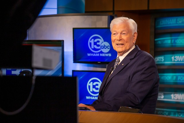Don Alhart sits at the anchor desk in the WHAM-TV studio, where he's worked since 1966.