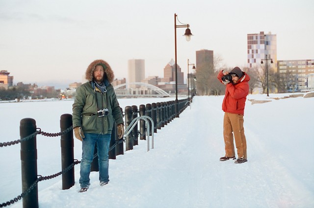 Brian and Brandon Wright, the founders of CineStill, walk along the Genesee River during one of their trips to Rochester from Los Angeles.