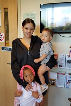 Karla Reyes Ríos, photographed with two of her children, has struggled, but, she says, “I like Rochester a lot.”