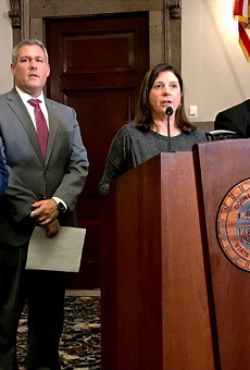 Republican Monroe County Legislator Karla Boyce, flanked by Democrats, explains her decision to vote to repeal the "police annoyance" law she sponsored months ago. Pictured with her are Democratic Minority Leader Vincent Felder, County Executive Adam Bello, and Legislator Ernest Flagler-Mitchell.