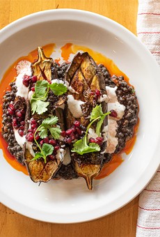 Roasted eggplant with lentils, crispy Brussels sprouts, chevre, and ras el hanout.