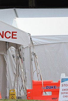 Strong Memorial Hospital has set up an emergency department check-in tent at the facility's entrance.