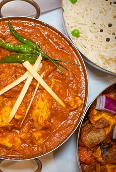The Kadai Chicken at Thali of India is topped with peppers and ginger.