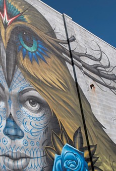 A detail of the finished mural, "Love is Sacrifice," by Jeff Soto and Maxx242.