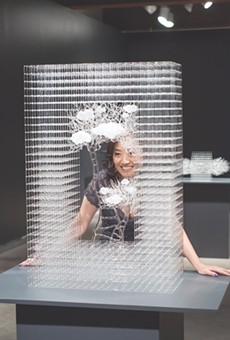 Eunsuh Choi with one of her intricate glass sculptures.