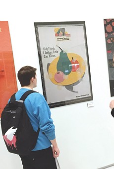 Students check out the Milton Glaser poster show currently on view at RIT's University Gallery.