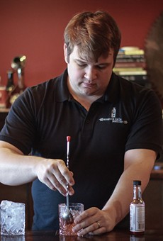 Co-owner and Head Distiller Teal Schlegel mixes a Sazerac with Honeoye Falls Distillery rye whiskey.