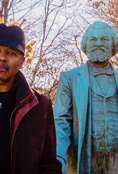 "Re-Energizing the Legacy of Frederick Douglass" project director Carvin Eison with the statue of Frederick Douglass in Highland Park. The statue will be moved to South and Robinson this spring, and is at the center of several upcoming art-related events.