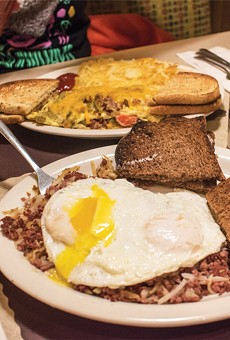 The homemade corned beef hash with over-easy eggs and
pumpernickel toast (front) and Artist's omelet (back) at Jim's at The Mall.