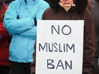 Photo Gallery: Rally draws opposition to Trump's ban