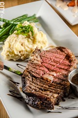 PHOTO BY MARK CHAMBERLIN - Prime rib with mashed potatoes and green beans.
