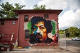PHOTO BY LISA BARKER - Baltimore artist Earnest Shaw Jr. painted this mural of Jimi Hendrix in the Susan B. Anthony neighborhood as part of Wall\Therapy 2014.