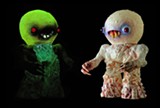 PHOTO PROVIDED - Bob Conge creates collectible art toys offered through his company, Plaseebo. Pictured: "Atomic Nosferatu Night Gamer," with LED lights activated (on the left)