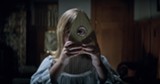 PHOTO COURTESY UNIVERSAL PICTURES - Lulu Wilson spies something sinister in "Ouija: Origin of - Evil."