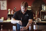 PHOTO BY KEVIN FULLER - Co-owner and Head Distiller Teal Schlegel mixes a Sazerac with Honeoye Falls Distillery rye whiskey.