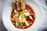 PHOTO BY KEVIN FULLER - Vesta's Roman Hearth focuses specifically on traditionally Roman cuisine, like the Stufato di Pesci, which includes Cod, mussels, clams, and shrimp in a saffron tomato broth.