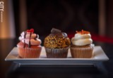 PHOTO BY KEVIN FULLER - Ryan Swift wanted to add an alternative edge to his cakery, Sinful Sweets, so gives his cupcakes names like Lust (left); Holy Night (middle); and Cursed Carrot (right).