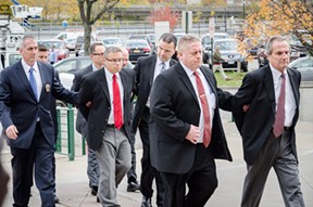 Robert Wiesner (far right) is taken to his arraignment. - PHOTO BY MARK CHAMBERLIN